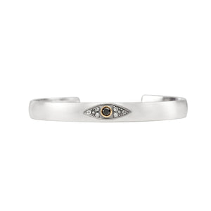 Sterling silver stacking cuff with black diamond evil eye in 14K yellow gold bezel with champagne diamonds