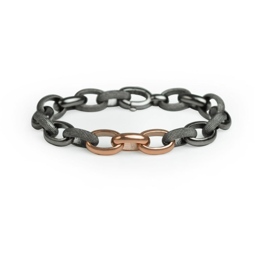 Textured silver link bracelet with three rose gold accent links