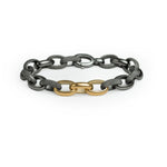 Textured silver link bracelet with three yellow gold accent links