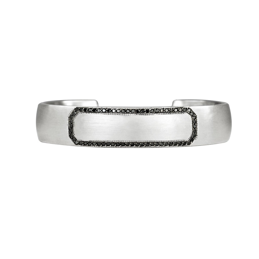 Sterling silver cuff bracelet with black diamond border and blank center space that is engraveable